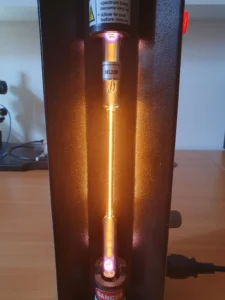 Helium discharge tube glowing yellow